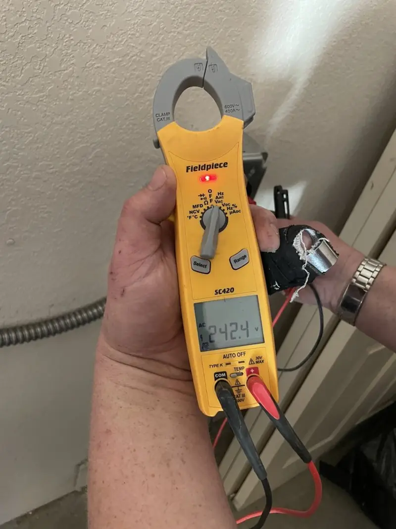 Voltage testing with clamp meter during Electrical Installation Services in Oxford